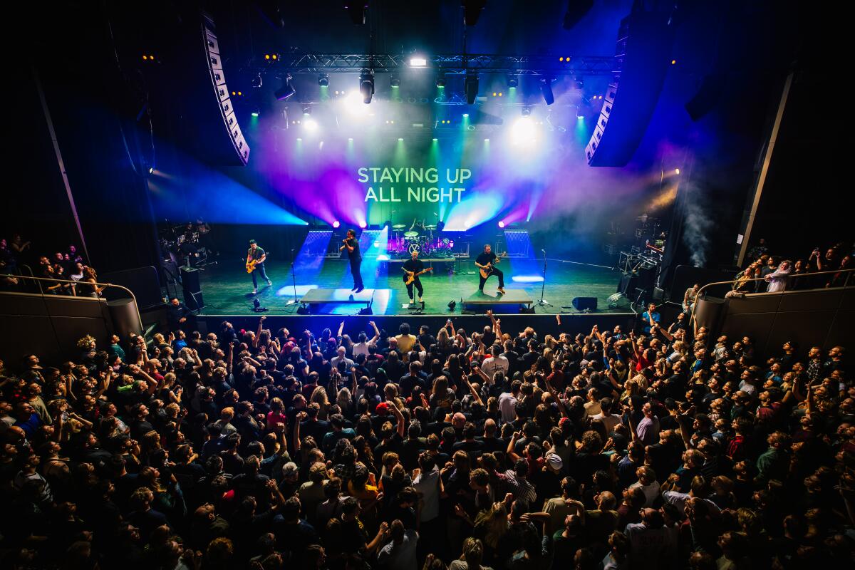 Yellowcard performing for a large crowd