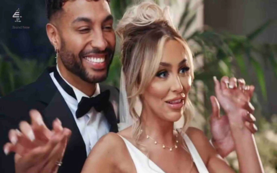 Ella Morgan and Nathaniel Valentine smiling in their wedding attire.