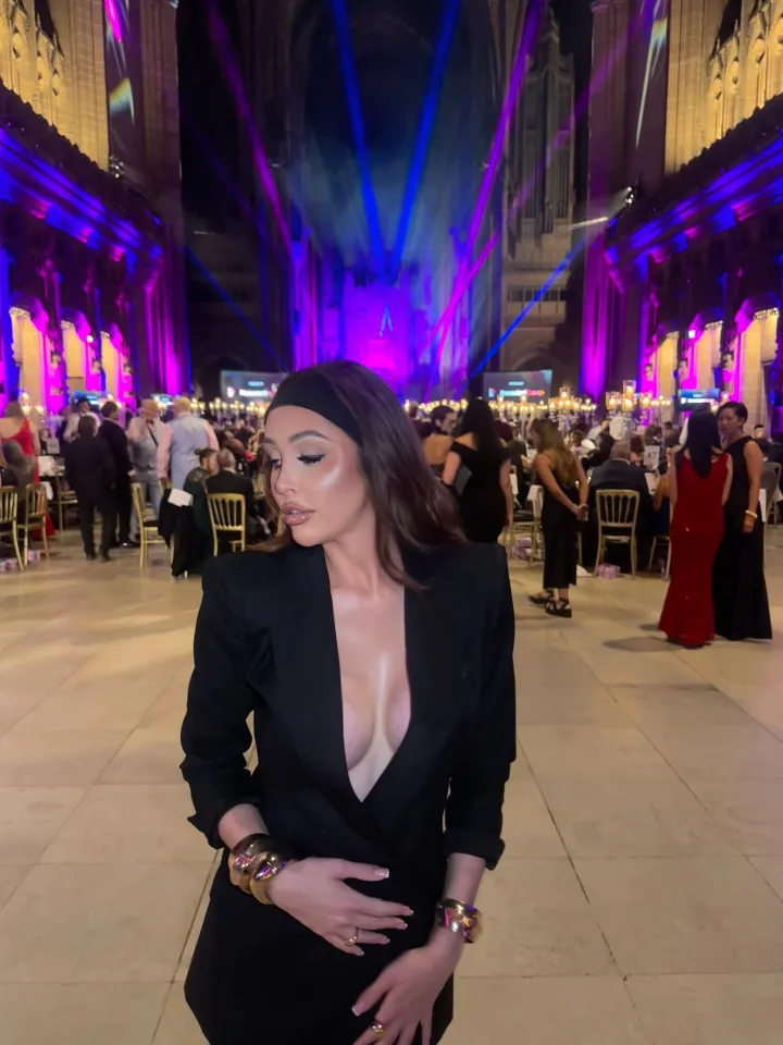 Ella Morgan posing in a black blazer at a formal event.