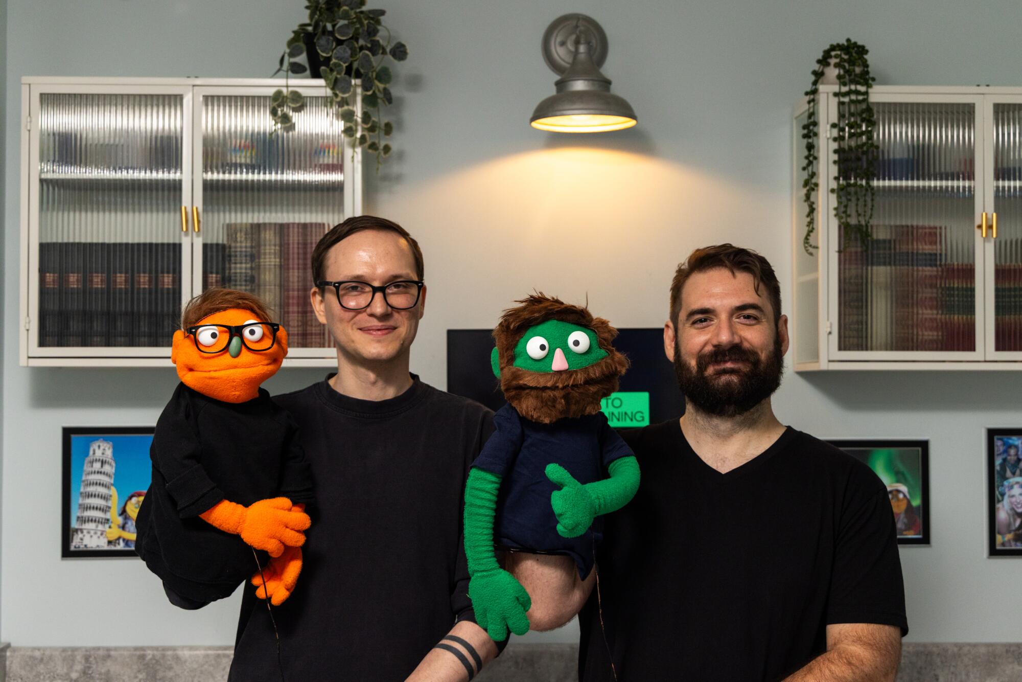 Patrick Fye and Matthew Tye, founders of Appleseed Avenue, along with their lookalike puppets.