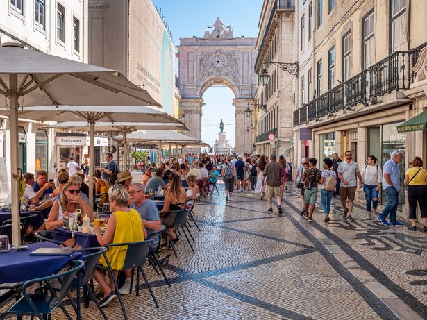 Lisbon, Portugal - August 10, 2018: view of the iconic architecture of Lisbon in Portugal showcasing its colonial buildings mixed with contemporary ones and lots of tourists and locals passing by having a lot of fun.