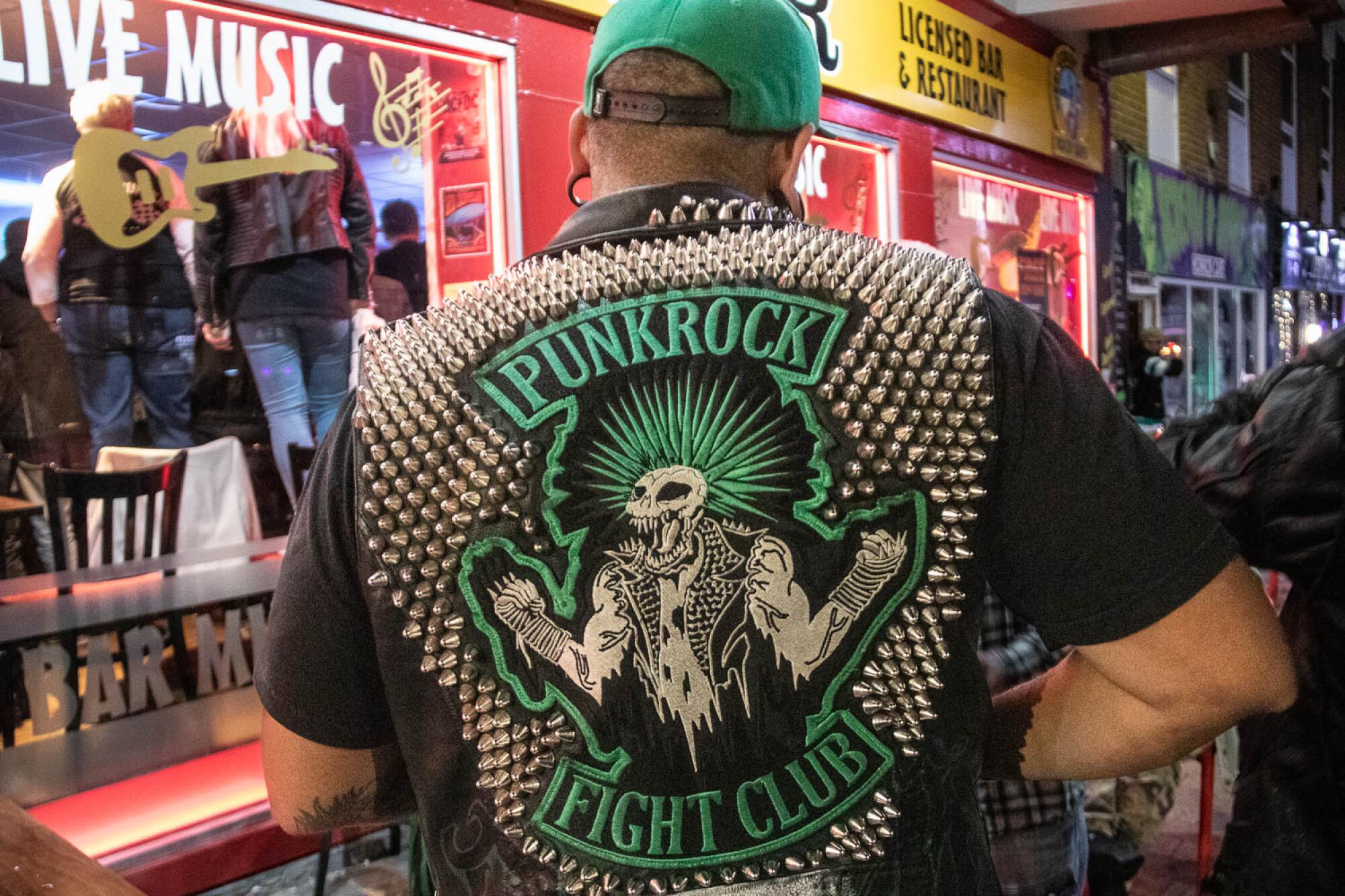Saus, co-founder of the KnuckleHeadz, wearing the band's signature vest.