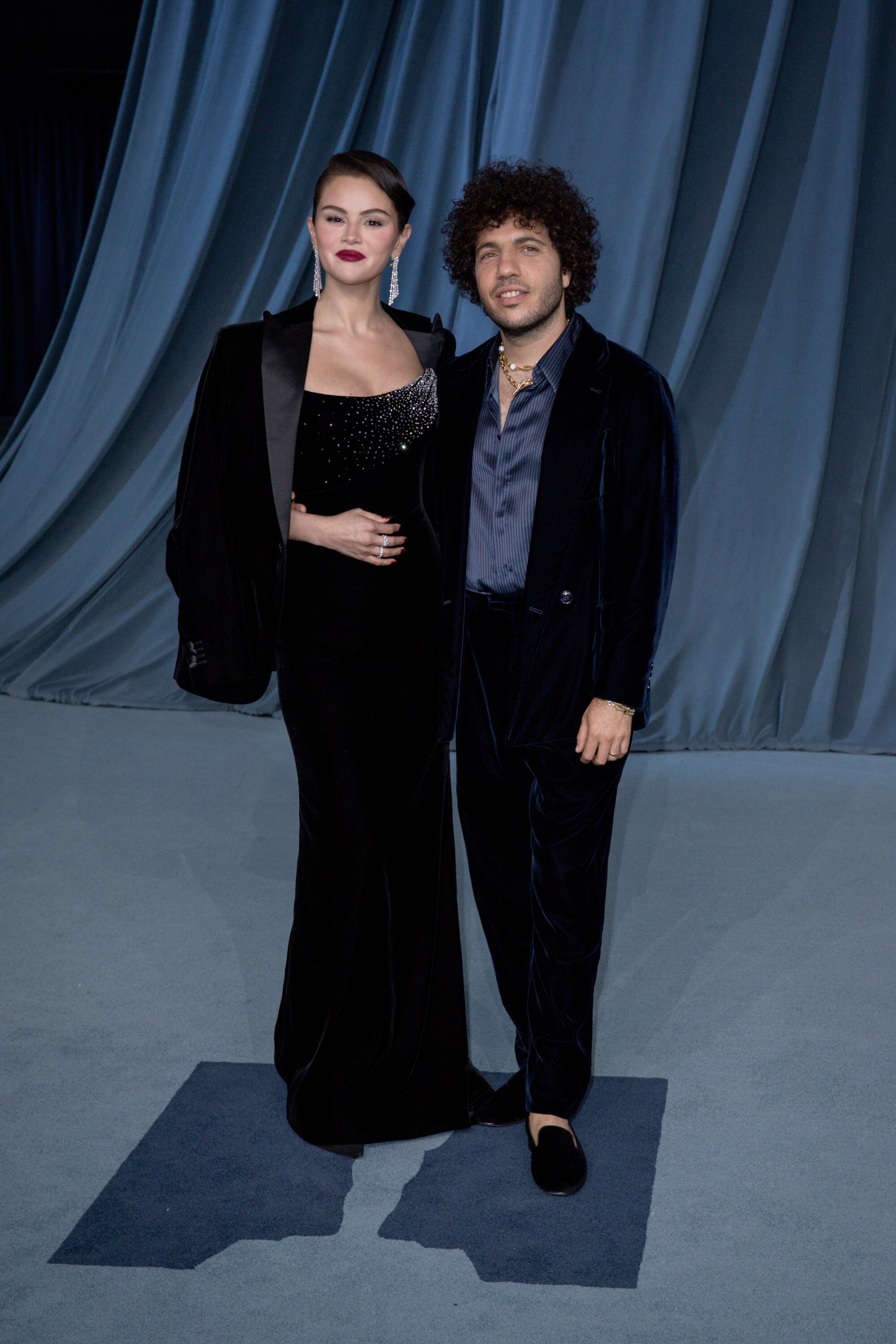 Selena Gomez and Benny Blanco pose on the red carpet.