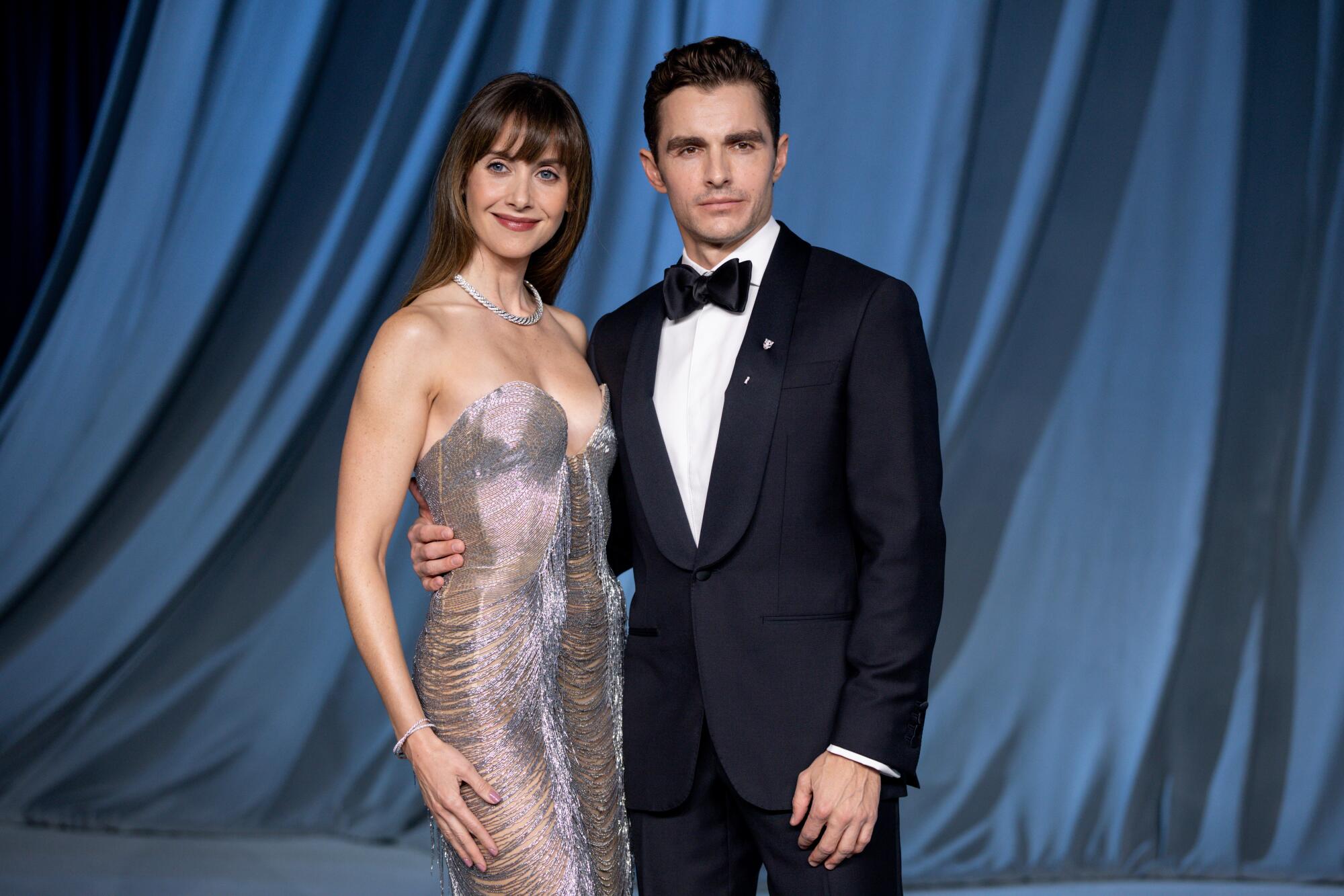 Alison Brie and Dave Franco pose together.