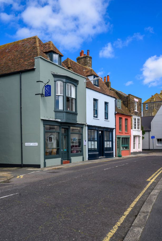 summertime view along beach street in Deal, showing shops and houses