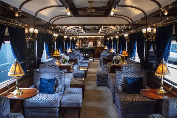 The art deco bar lounge wagon of the train Belmond Venice Simplon Orient Express luxury train.
