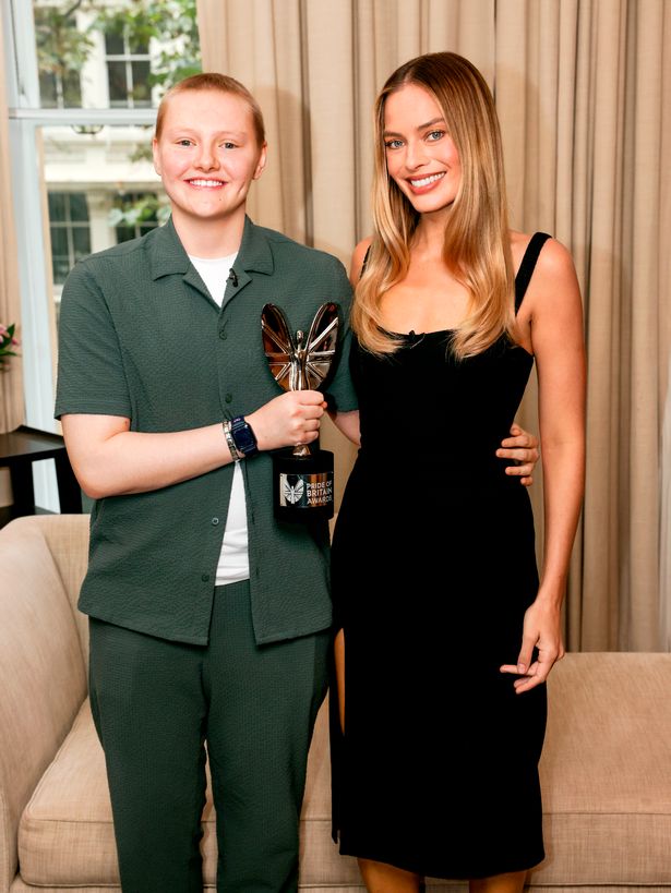 GMB Young Fundraiser winner Georgie Hyslop receives her nomination and award from actress Margot Robbie.