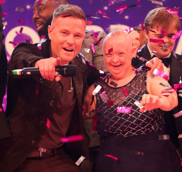 Nicky Byrne of Westlife performing with a member of Ups & Downs who won the Local Hero award.