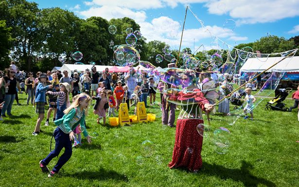 Entertainers make bubbles for children at Greville Smyth Park, on May 28, 2022 in Bristol, England.