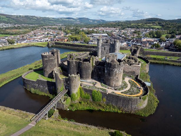 Editorial Caerphilly, Wales - September 16, 2025: Drone view of Caerphilly Castle, the biggest in Wales, built in the 13th century to maintain control of Glamorgan.