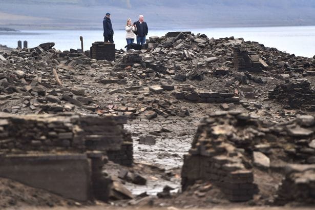 SHEFFIELD, ENGLAND - NOVEMBER 18:  The ruins of Derwent Hall are exposed by low water levels in Ladybower reservoir on November 18, 2018 in Sheffield, England. The villages of Derwent and Ashopton in Derbyshire were deliberately flooded in 1943 to create Ladybower and Derwent reservoir, famously used by the Dambusters for practice missions during the Second World War.  (Photo by Anthony Devlin/Getty Images)