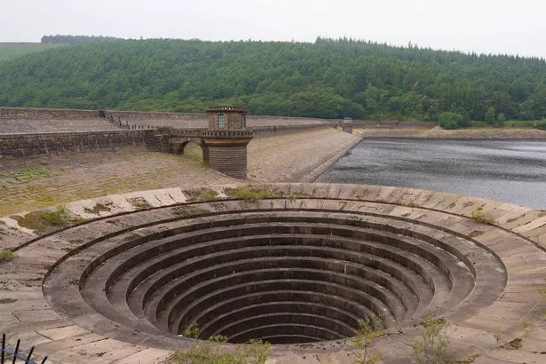 Low water levels expose the bell mouth spillway at Ladybower Reservoir, in Derwent Valley, UK, on Monday, Aug. 18, 2025. More parts of the UK entered drought conditions, after England had its driest start to the year since 1976 and heat waves boosted water demand. Photographer: Dominic Lipinski/Bloomberg via Getty Images