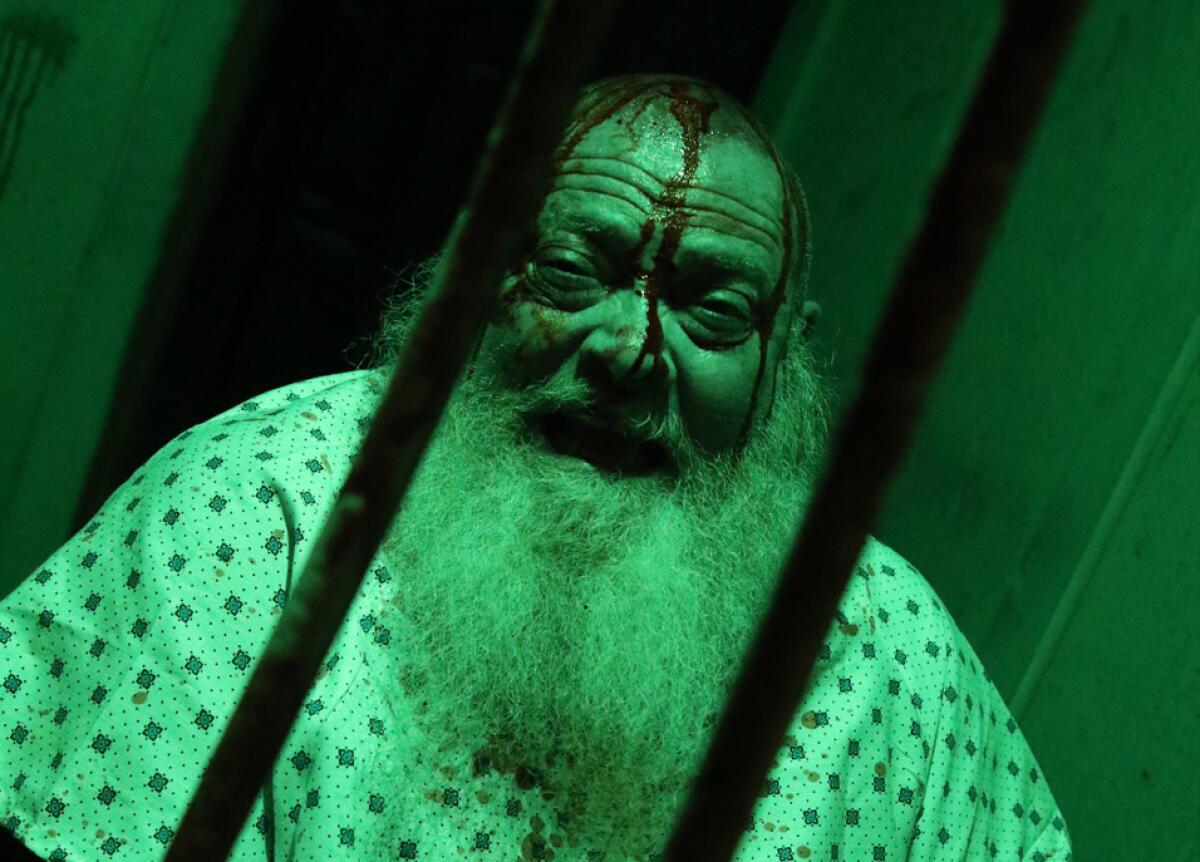 A scare actor ready for his next victim.