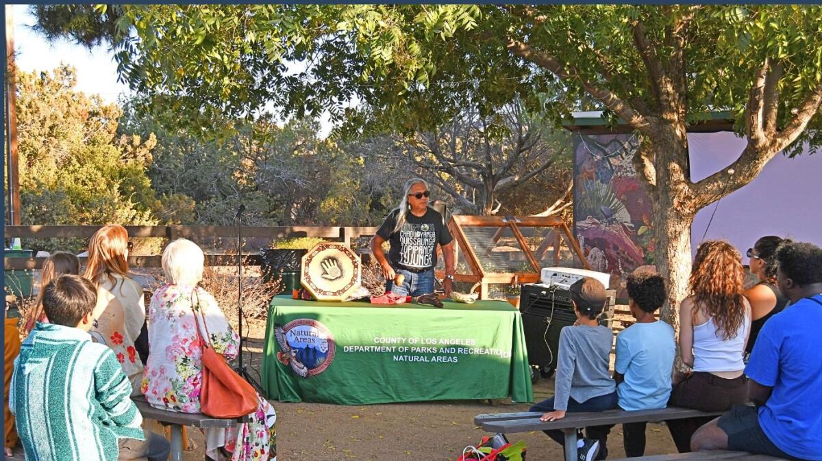 An Indigenous People's Day celebration with several people in view.