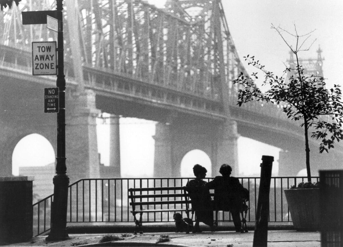 Mary Wilke (Diane Keaton) and Isaac Davis (Woody Allen) in the shadow of the Queensborough Bridge in the movie "Manhattan."