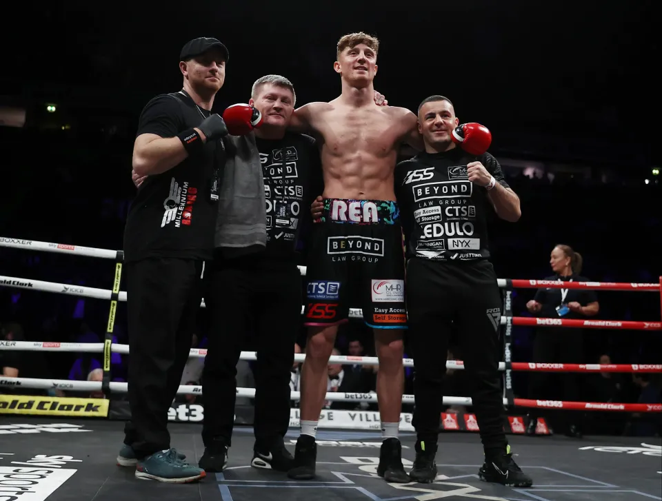Brad Rea celebrating his middleweight contest win with his team.