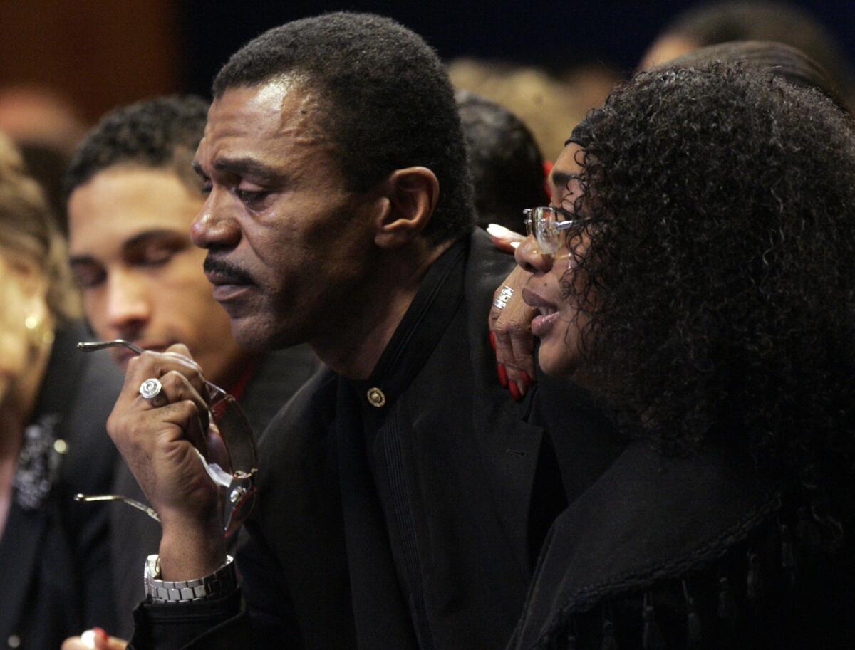 Ike Turner Jr. and friend Mary Ellis dressed in black