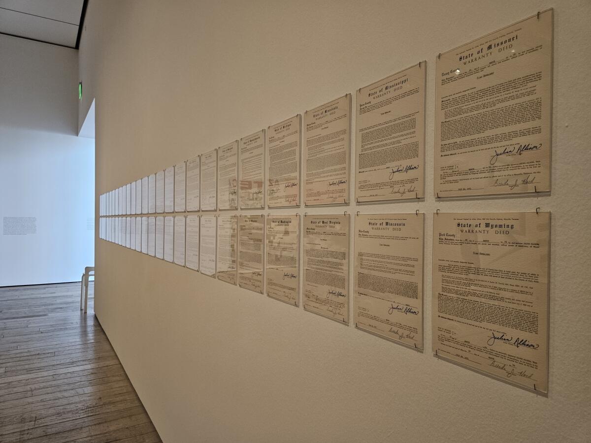 Siah Armajani's 1970 "Land Deeds" records his purchase of one square-inch of all 50 U.S. states.