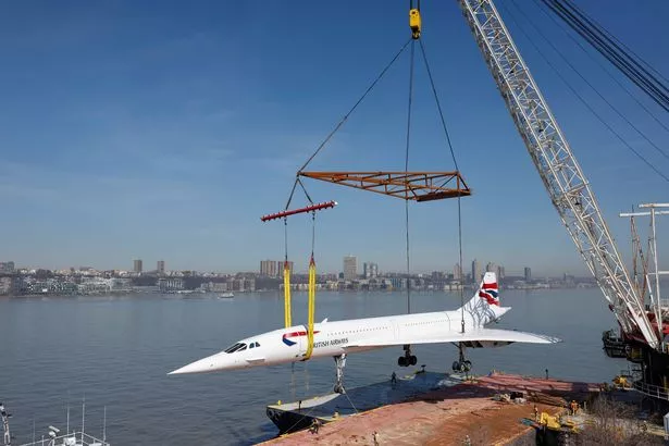 NEW YORK, NEW YORK - MARCH 14: A retired British Airways Concorde supersonic airliner is lifted by a crane as it is returned to the Intrepid Museum on March 14, 2024 in New York City. The Concorde, one of a fleet of seven once owned by British Airways, departed the Weeks Marine in Jersey City, N.J. for it's return to the Intrepid Museum following a months-long restoration project at the Brooklyn Navy Yard.  (Photo by Michael M. Santiago/Getty Images)