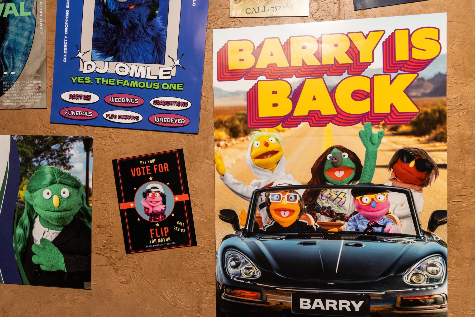 Campaign posters for puppet candidates for mayor inside Appleseed Avenue.