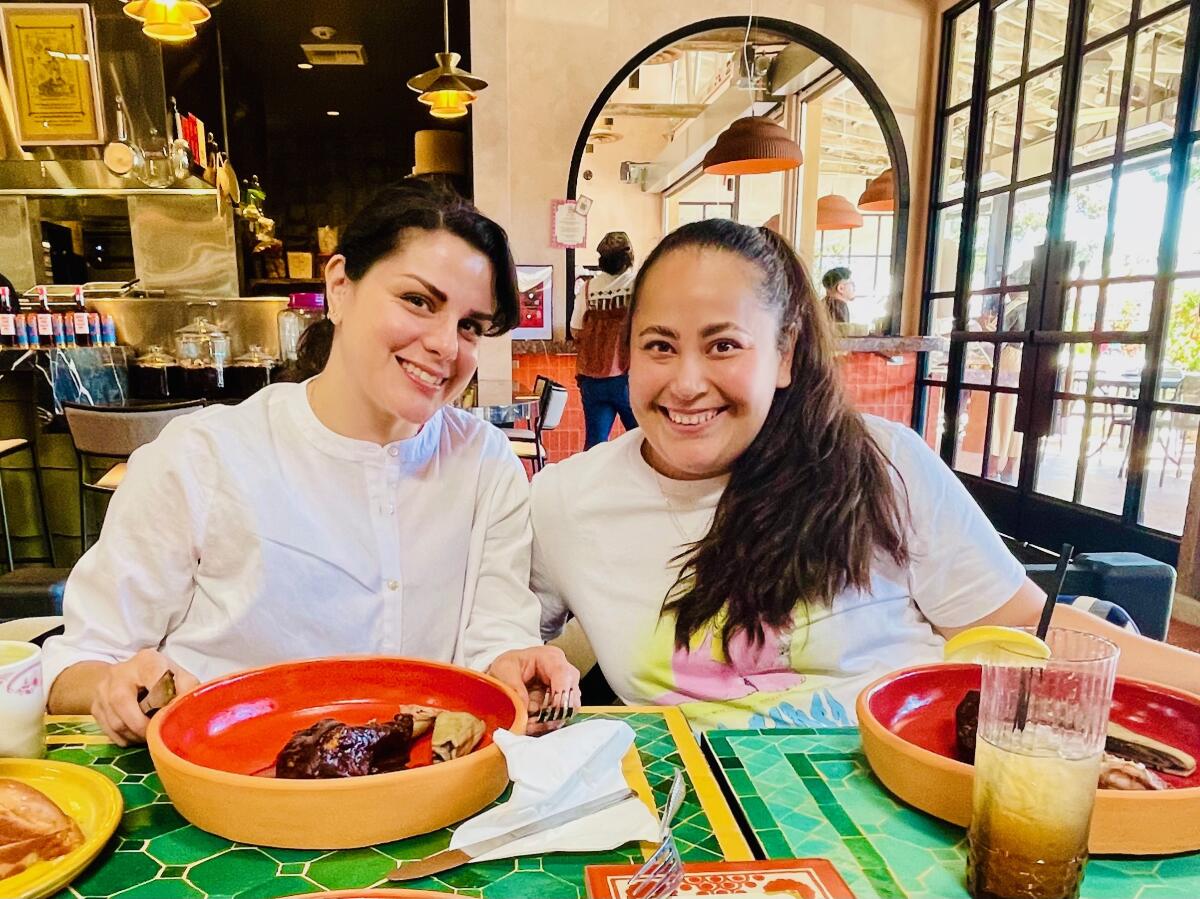 Oct 16, 2025--Chefs Rosio Sanchez, left, and Laura Flores Correa sit at Maydan Market in L.A.