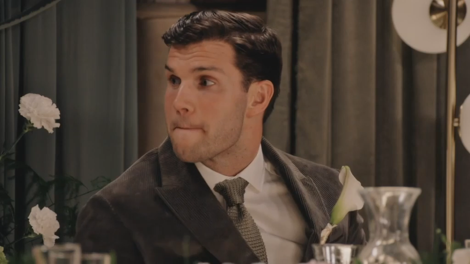 Reiss looking uncomfortable as he is grilled by his bride.