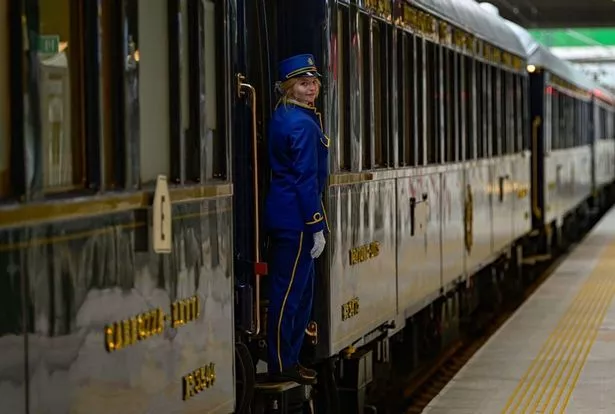  An employee stands on the step of The Venice Simplon-Orient-Express at Istanbul Station in Istanbul, on August 31, 2022.