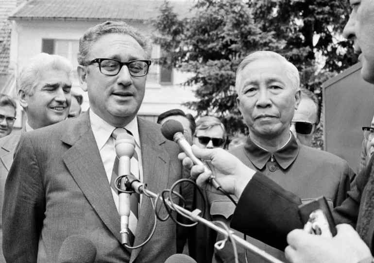 Henry A. Kissinger, left, President Nixon's National Security Adviser and Le Duc Tho, member of Hanoi's Politburo, are shown outside a suburban house at Gif Sur Yvette in Paris, June 13, 1973, after negotiation session, as Kissinger announced that they will later initial an agreement intended to tighten enforcement of the Vietnam Peace Agreement. (AP Photo/Michel Lipchitz)