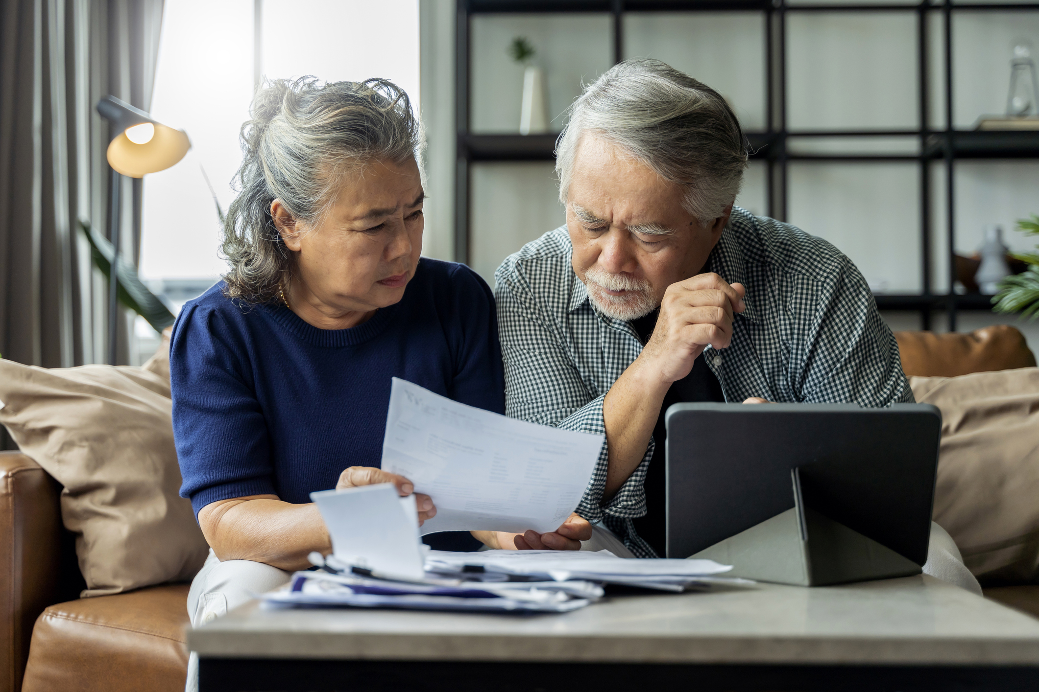 Two people looking at documents together.
