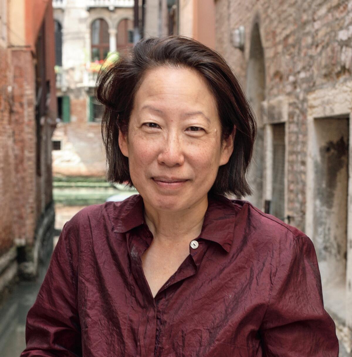 Gish Jen stands in front of a Venice canal. 