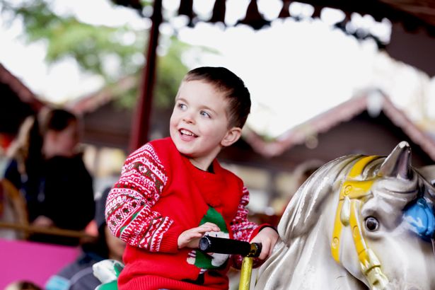 Child on carousel