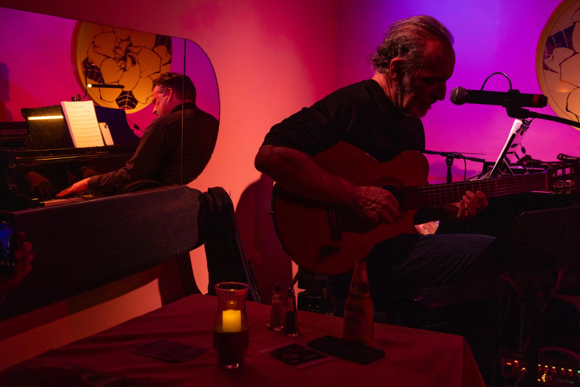 Pianist Andy Langham and guitarist Dori Amarilio