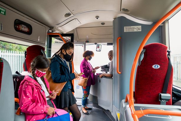 People getting onto bus