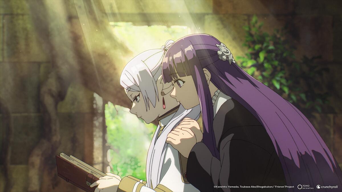 two women reading a book