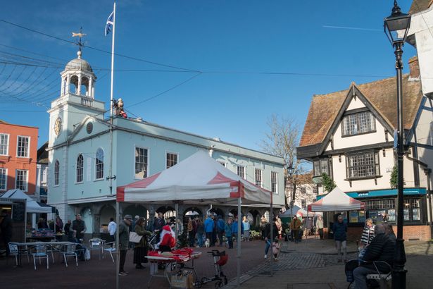 The Town Hall with tourists and shoppers in the medieval market town of  Faversham, Kent, UK