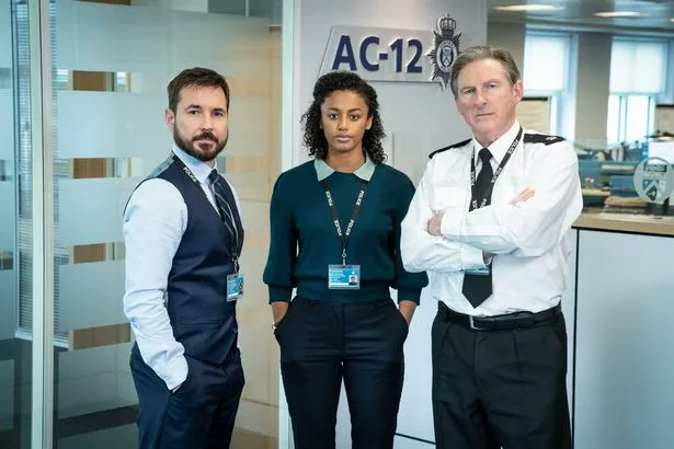 Adrian Dunbar as Superintendent Ted Hastings (right), Martin Compston as DI Steve Arnott and Shalom Brune-Franklin as DC Chloe Bishop in Line of Duty. 