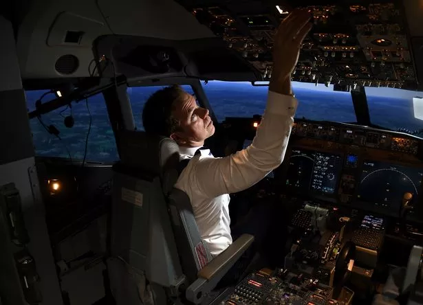 Pilot using a flight simulator