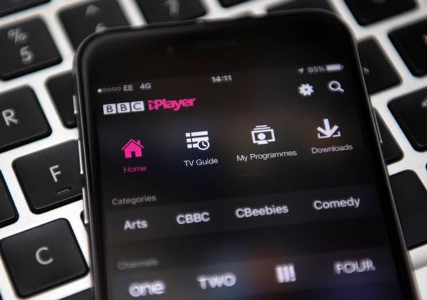LONDON, ENGLAND - AUGUST 02:  In this photo illustration, the BBC iPlayer app is displayed on an iPhone left over a laptop keyboard on August 2, 2016 in London, England. The BBC has announced that iPlayer users will have to pay a 145GBP TV licence fee from 1 September.  (Photo Illustration by Carl Court/Getty Images)
