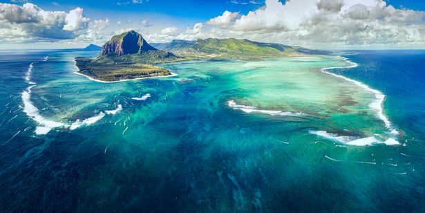 Aerial view of clear skies, sea water and islands