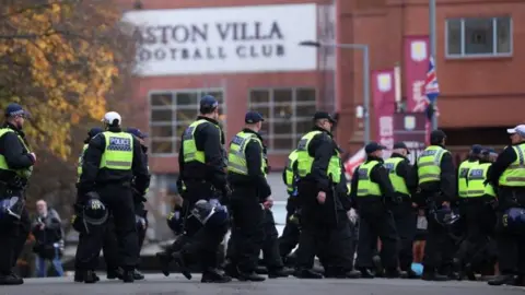 EPA Police officers have gathered from forces across the country, and are here assembling outside the Aston Villa ground.